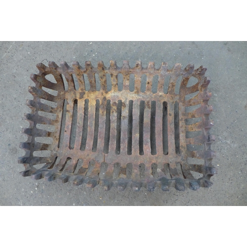 2289 - 2 Cast metal dog grates and a brass coal scuttle