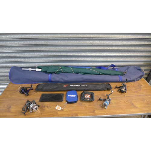 Assorted fishing equipment including Bivvy, umbrella and four reels ...