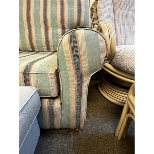 1547 - Striped upholstered three seater sofa and footstool