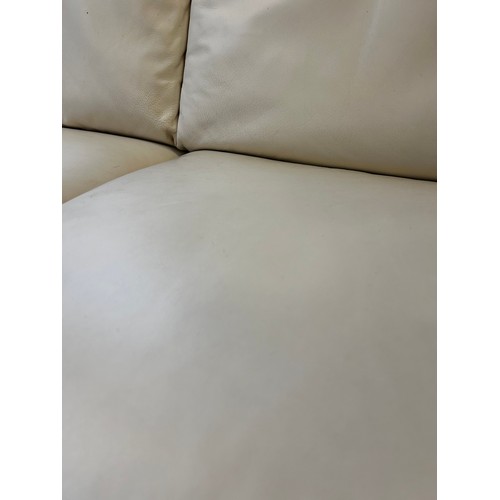 1605 - Cream leather two seater sofa