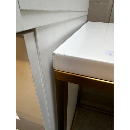 1637 - A white console table with gold base