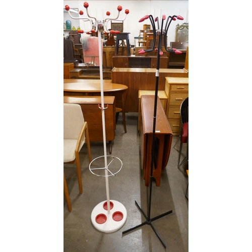 103 - Two black and white tubular metal atomic coat stands