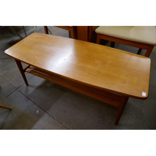 114 - A teak coffee table