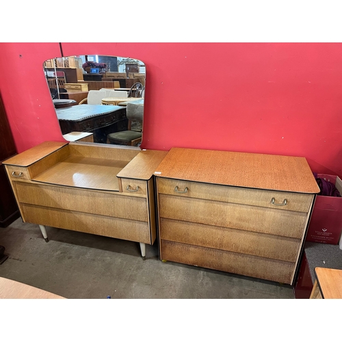 136 - A teak dressing table and matching chest of drawers