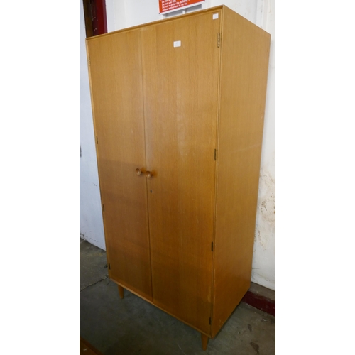 137 - A Meredew teak wardrobe