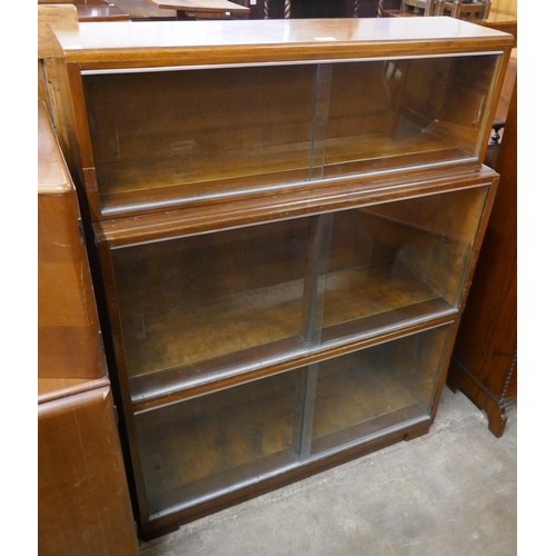 144 - A Minty mahogany three tier bookcase