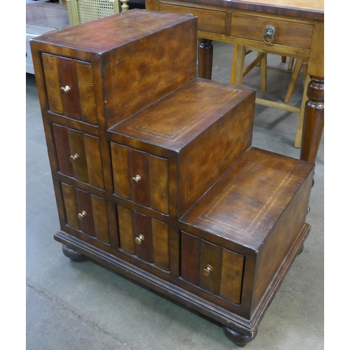 151 - A leather faux book fronted chest, in the form of Regency style library steps