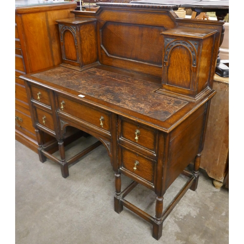 156 - An early 20th Century oak Dickens style desk