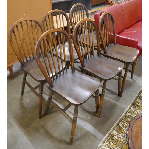 166 - A set of six early 20th Century elm and beech Windsor kitchen chairs