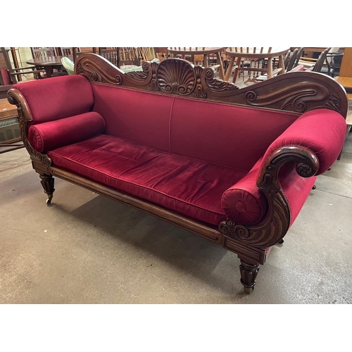 172 - A Regency carved mahogany and red fabric upholstered scroll end settee