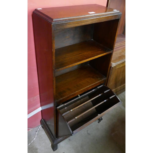 175 - An oak bookcase with integral magazine rack