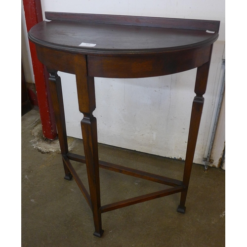 197 - An Edward VII oak demi-lune hall table