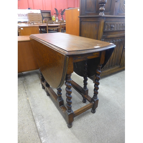 210 - An oak barleytwist gateleg table