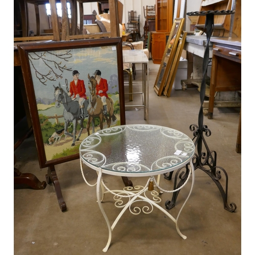 329 - A wrought iron and glass topped table, a tapestry firescreen and a metal plant stand