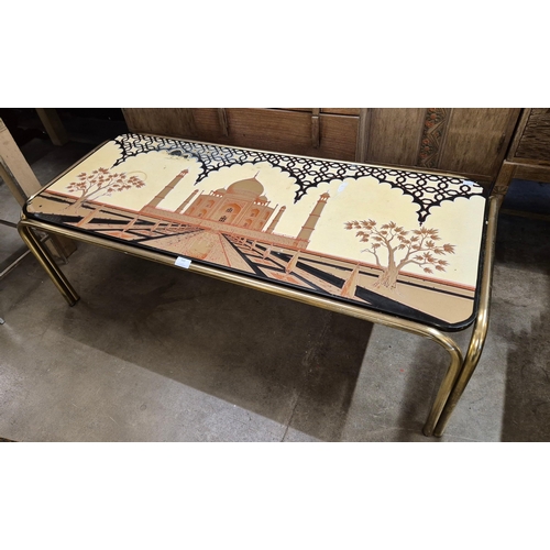 333 - A tubular metal coffee table, with laminated Taj Mahal top