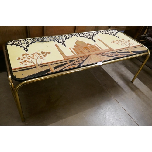 333 - A tubular metal coffee table, with laminated Taj Mahal top