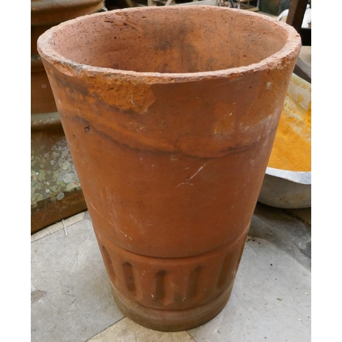 368 - A terracotta chimney-pot and a plant pot