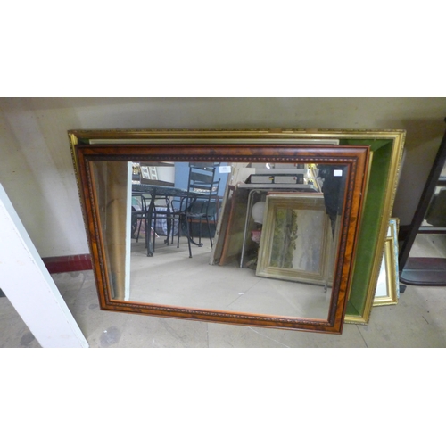 428 - Two large framed prints and a carved oak mirror