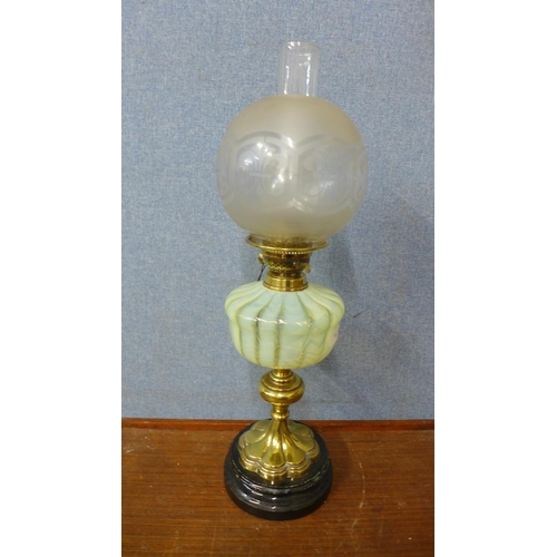 432 - A Victorian brass oil lamp, with Vaseline glass reservoir