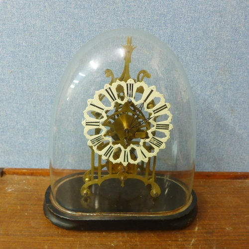 433 - A glass domed gilt metal fusee skeleton clock