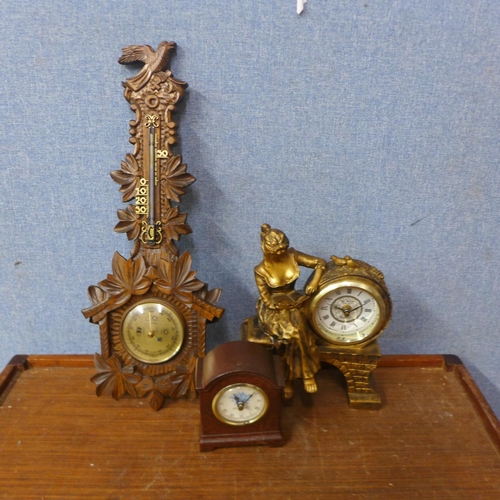 459 - A carved oak barometer and two clocks