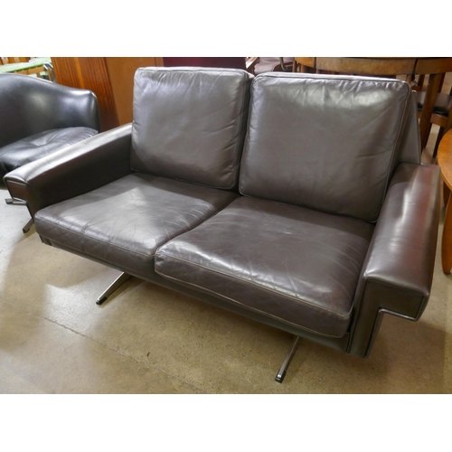 64 - A Danish Stouby chestnut brown leather two seater sofa