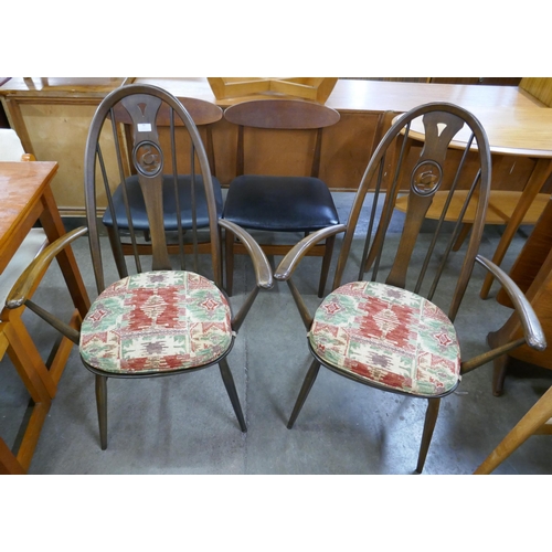 99 - A pair of Ercol Golden Dawn elm and beech swan back Quaker elbow chairs