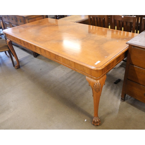 230 - A Queen Anne style walnut dining table