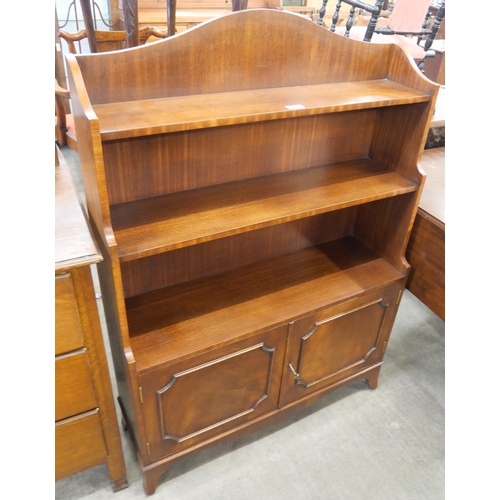 235 - A mahogany two door open bookcase