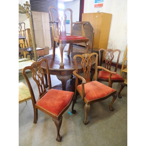 258 - An Edward VII Chippendale Revival carved mahogany extending dining table and four chairs