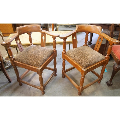 266 - A pair of Arts and Crafts style oak corner chairs