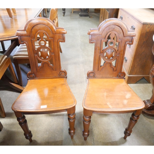 271 - A pair of Victorian mahogany hall chairs