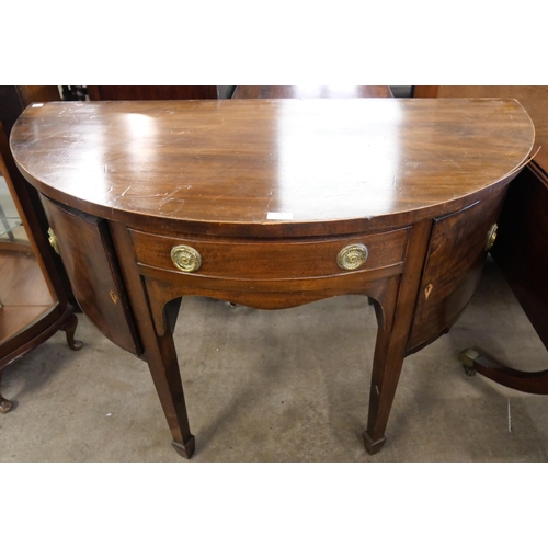 284 - A George III style mahogany demi lune sideboard