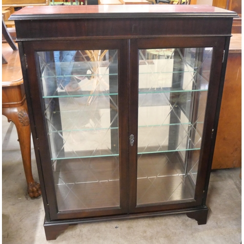 294 - An inlaid mahogany display cabinet