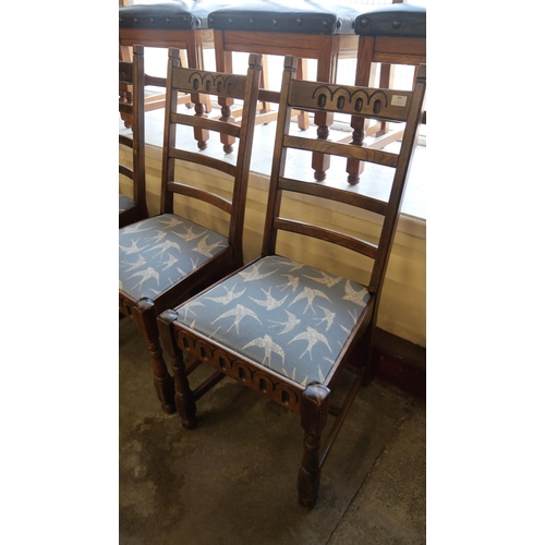 296 - Two sets of four oak dining chairs