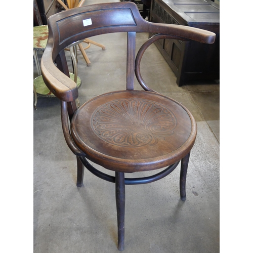 301 - A beech bentwood chair, a carved oak spinning chair and an onyx occasional table