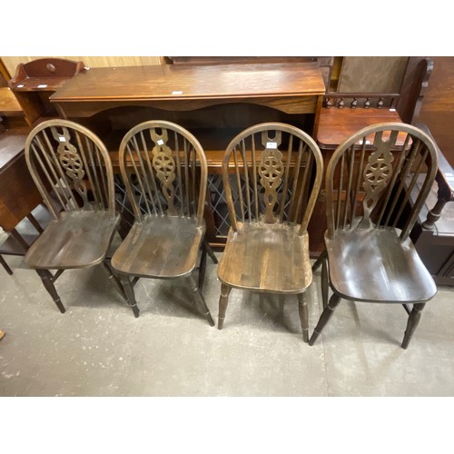 200 - A set of four beech wheelback kitchen chairs