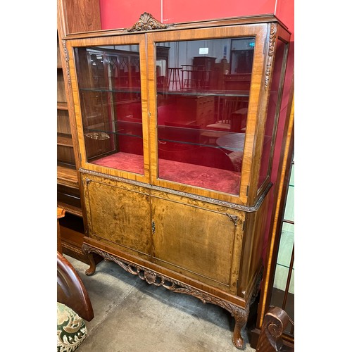 177 - A Queen Anne style burr walnut display cabinet