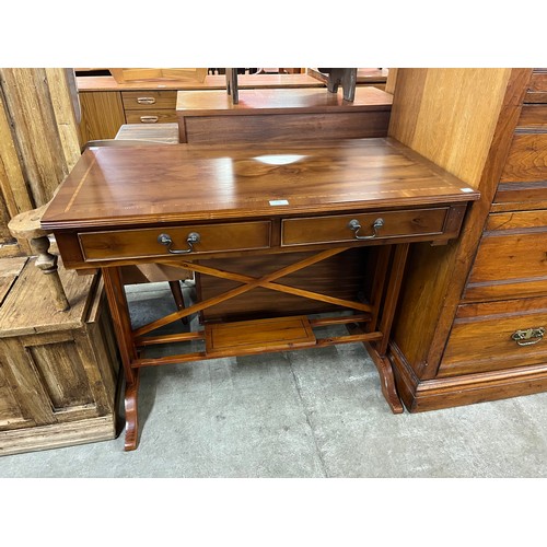 206 - A Regency style inlaid yew wood two drawer writing desk and a Victorian walnut chair