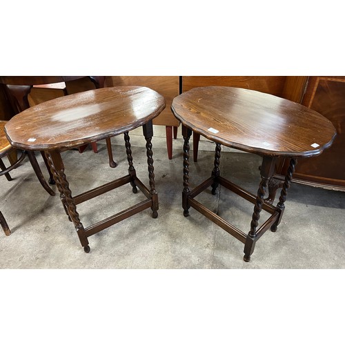 219 - A pair of oak barleytwist occasional tables