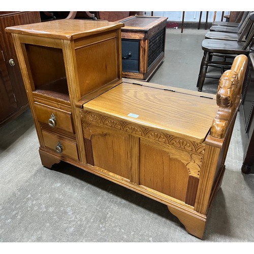 225 - A carved oak telephone seat