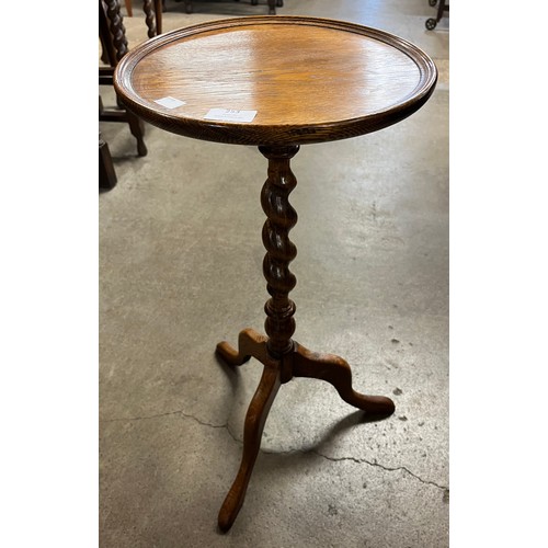 253 - An early 20th Century oak barleytwist tripod wine table