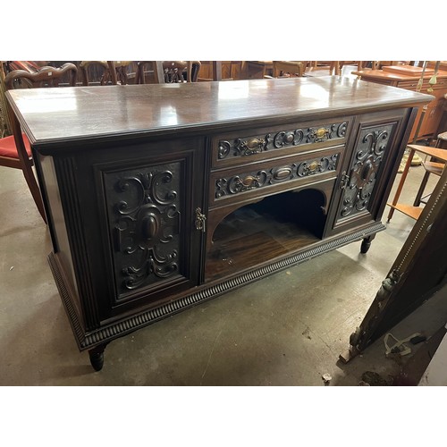 261 - A late Victorian carved walnut sideboard