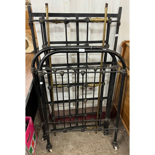 323 - A Victorian wrought iron and brass cot