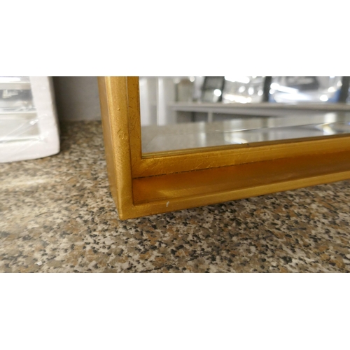 1317 - A bevelled gold framed mirror