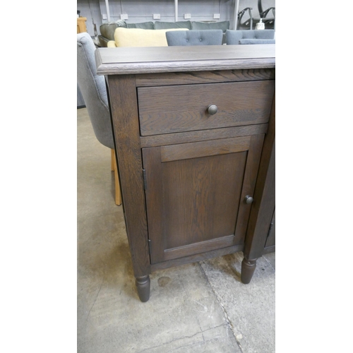 1321 - A four door dark oak sideboard