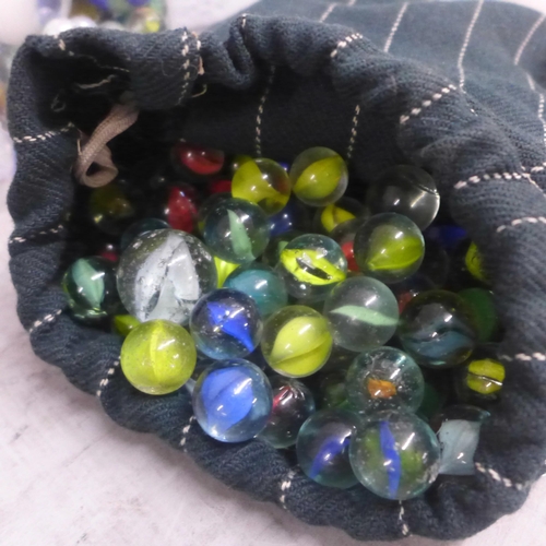 1064 - A collection of marbles and plastic toy soldiers, cowboys, Indians, etc. **PLEASE NOTE THIS LOT IS N... 