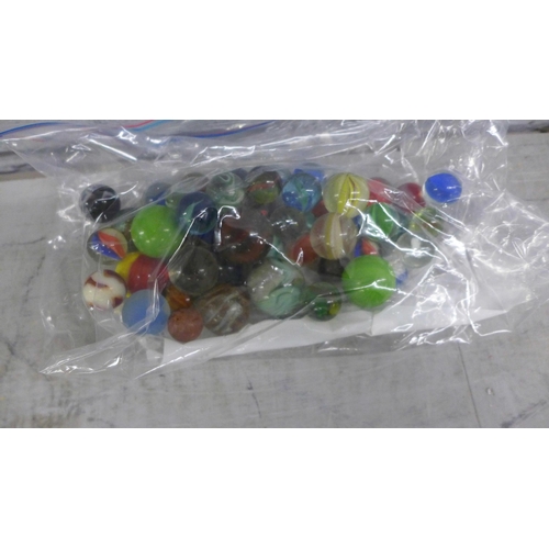 1064 - A collection of marbles and plastic toy soldiers, cowboys, Indians, etc. **PLEASE NOTE THIS LOT IS N... 