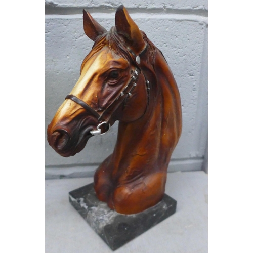 1083 - A horse door stop, two resin horse heads, a resin horse head on marble base and a set of Thornton & ... 