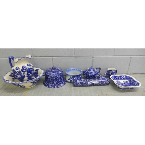 1084 - A Burleigh Calico blue and white rolling pin, a cheese dome and stand, tea pot, wash jug and bowl, e... 